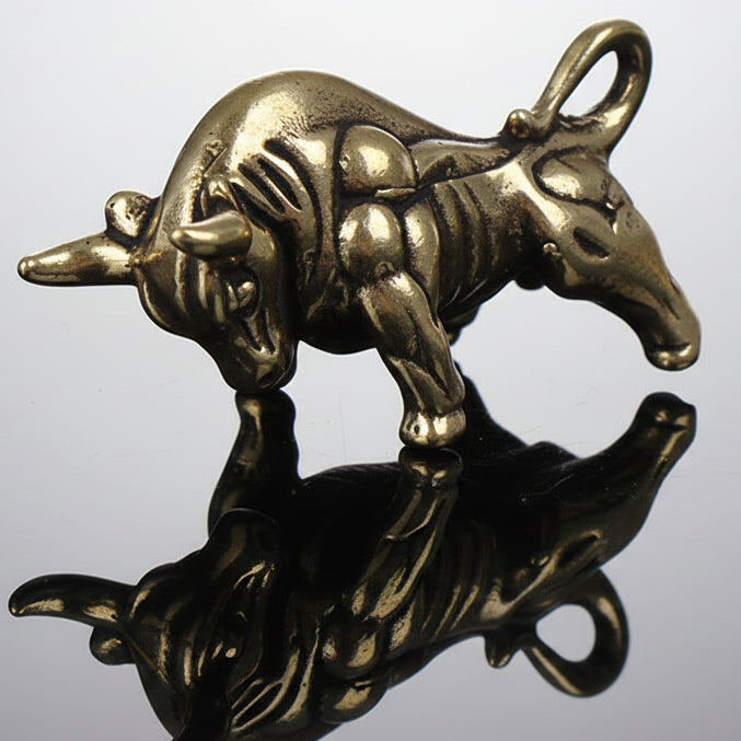 Bronze-colored dog skeleton pendant on a white background