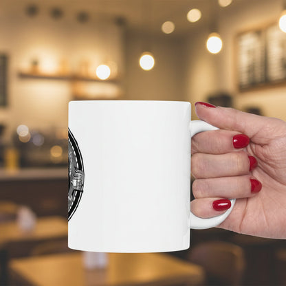 Hand with red nail polish holding a white mug on a white background