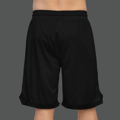 Black shorts with white speckle pattern worn by a person on a white background