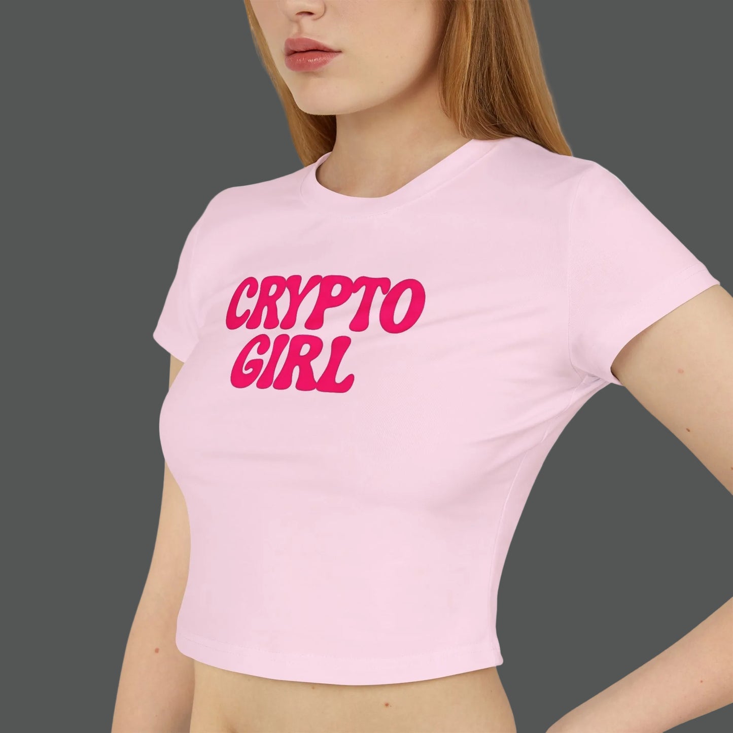 Person wearing a pink t-shirt with 'CRYPTO GIRL' text on a white background