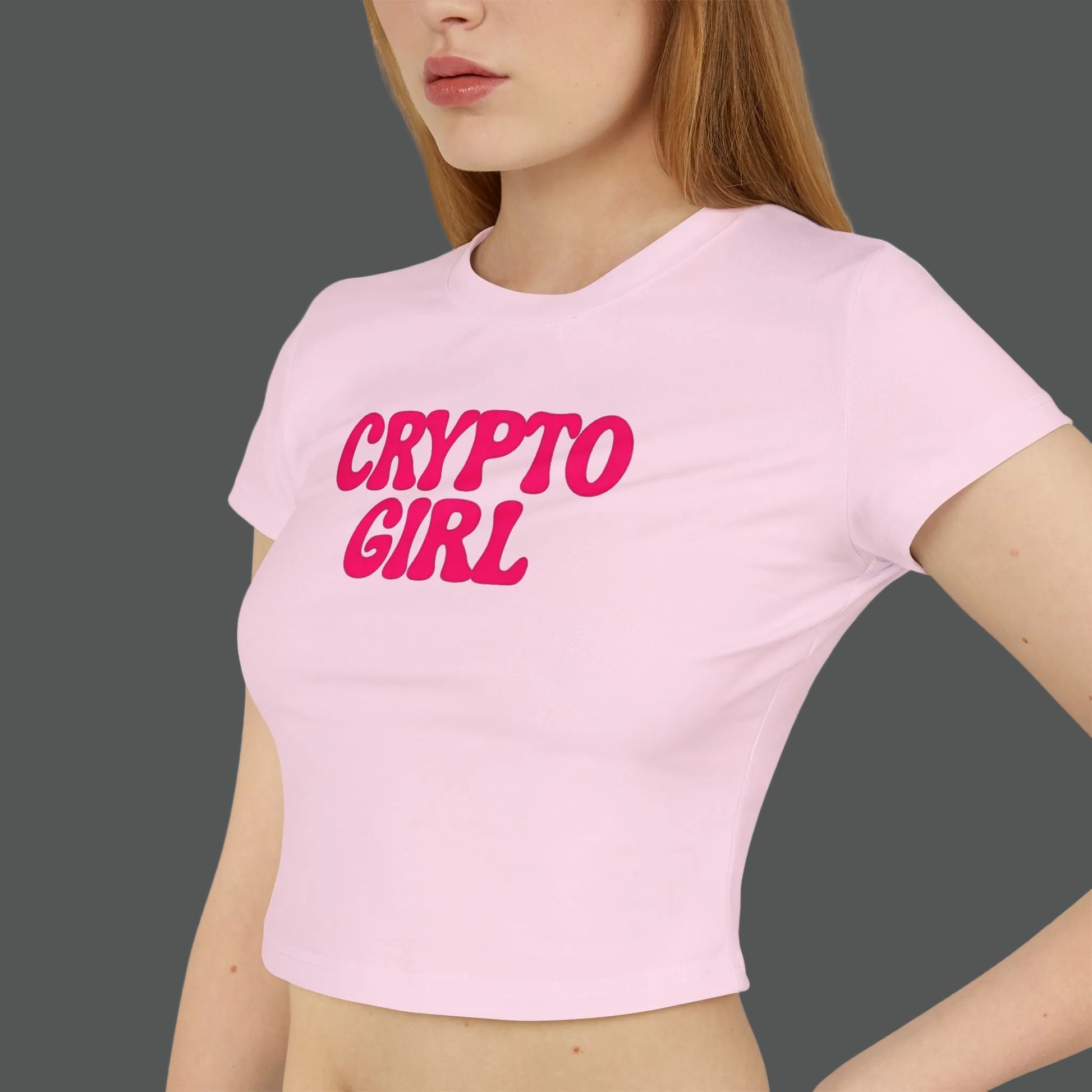 Person wearing a pink t-shirt with 'CRYPTO GIRL' text on a white background