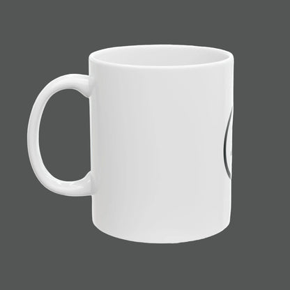 White mug with a black handle on a white background