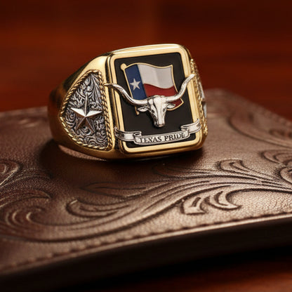 Gold ring with Texas flag and longhorn design on a white background