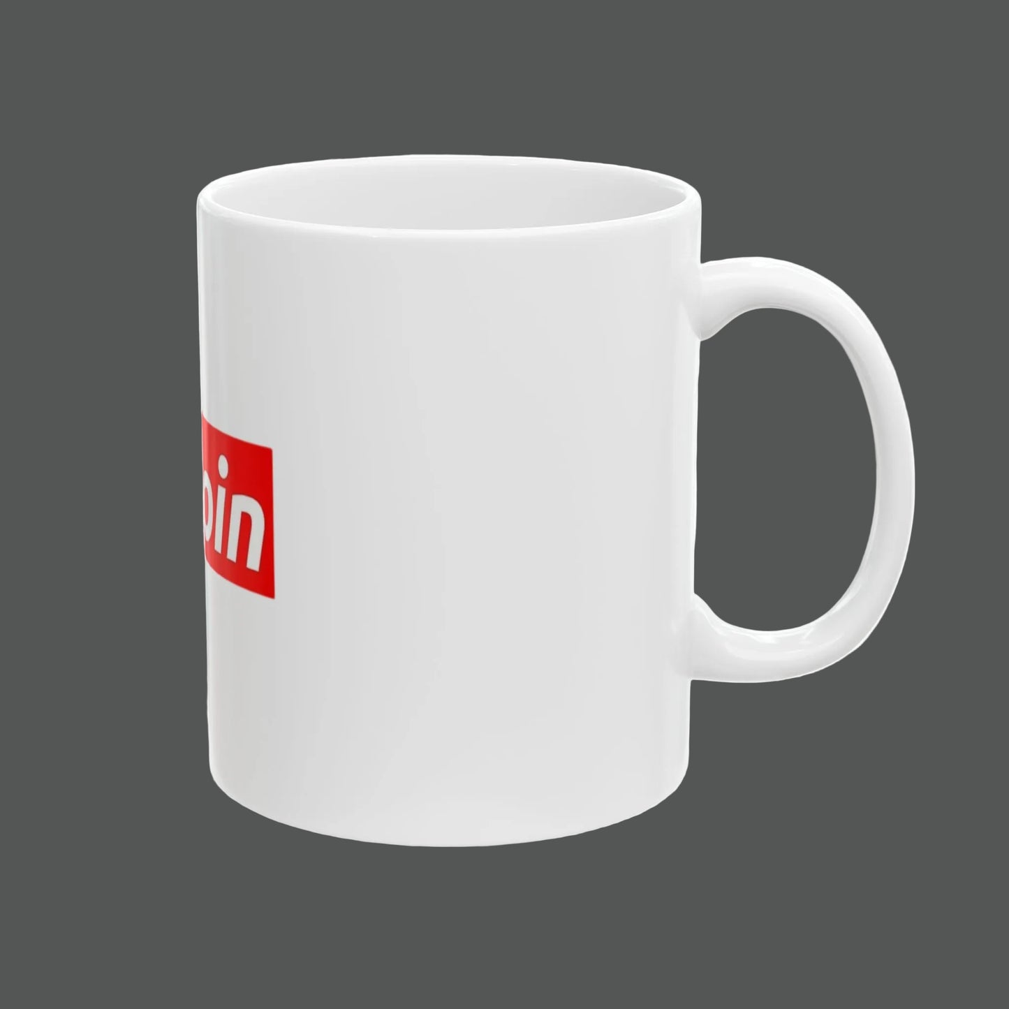 White mug with a red and white logo on a white background