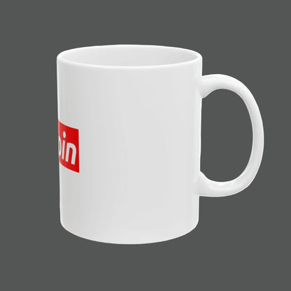 White mug with a red and white logo on a white background