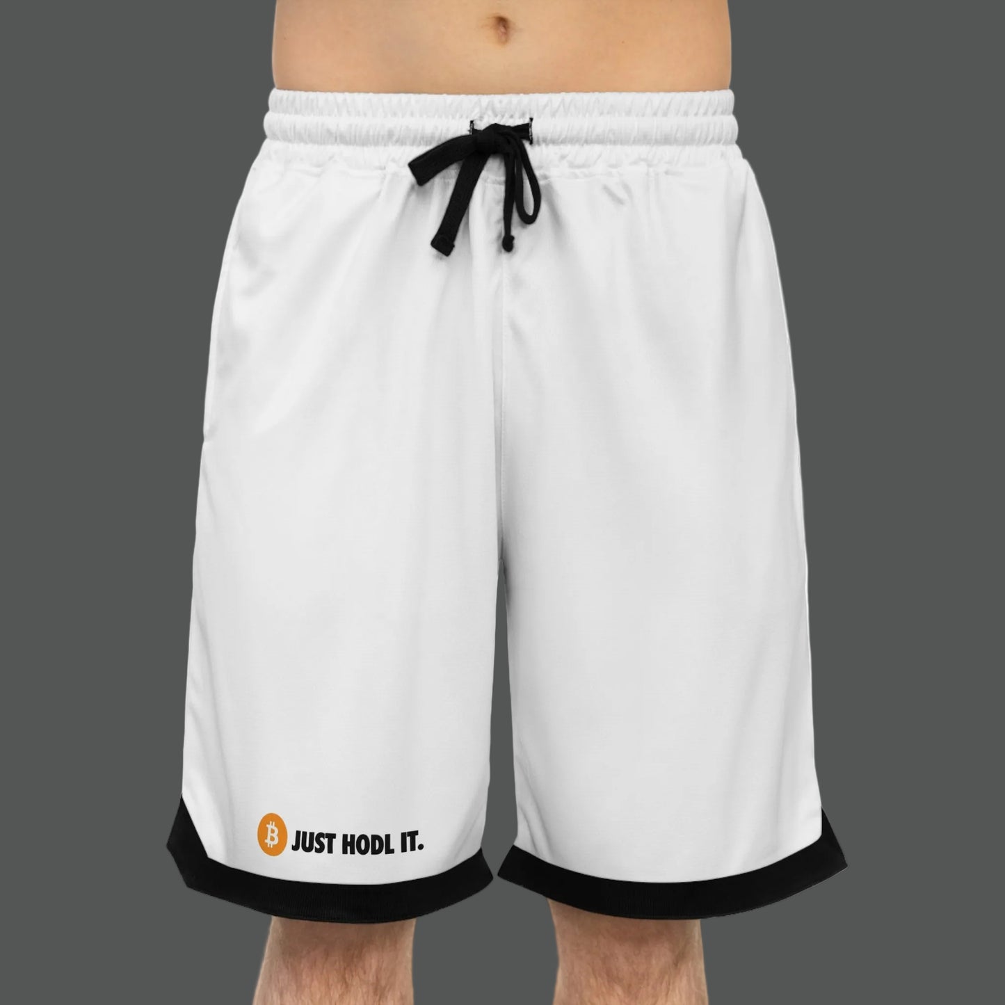White shorts with black trim featuring 'Just HODL IT.' text and Bitcoin symbol on a white background.