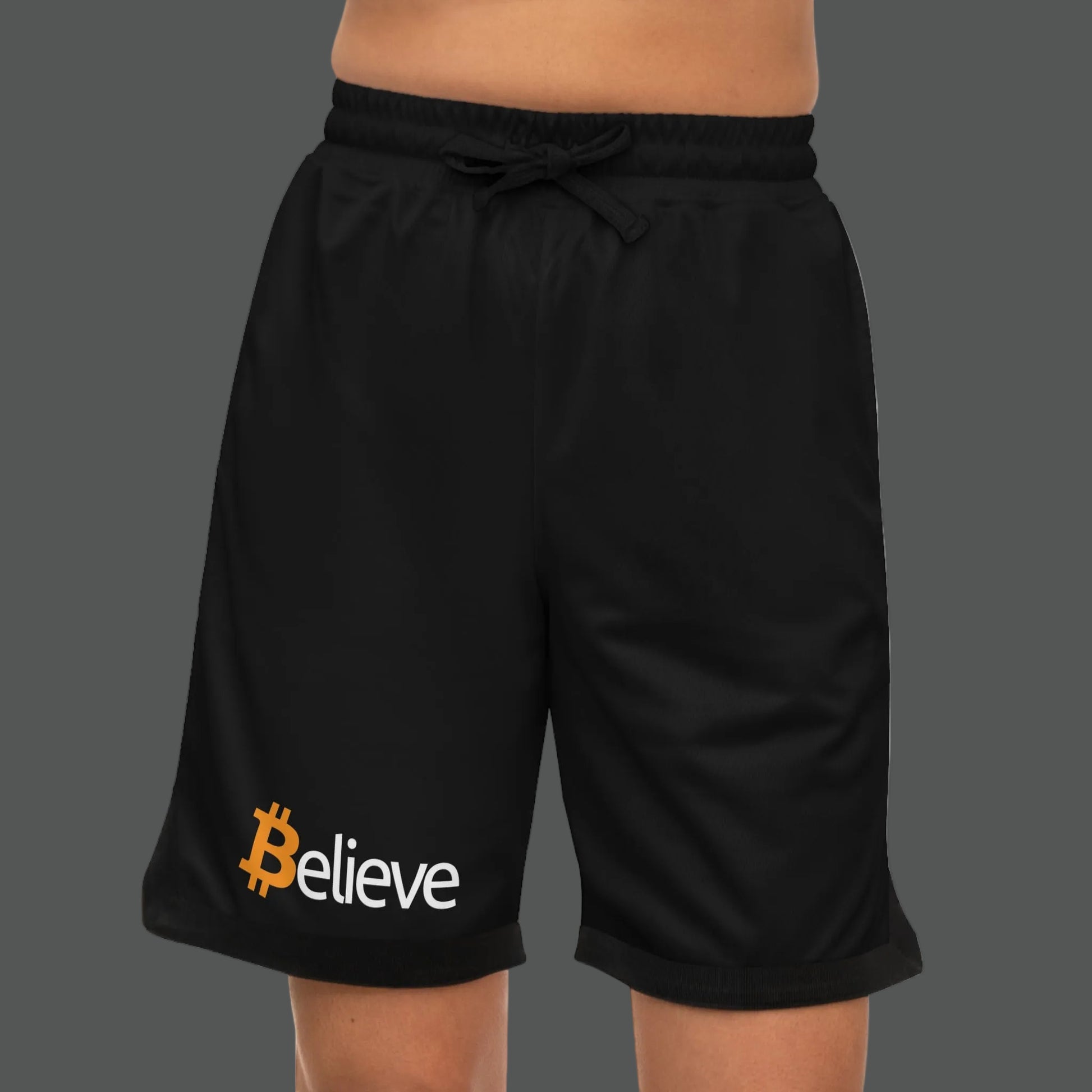 Black shorts with 'Believe' logo on a white background