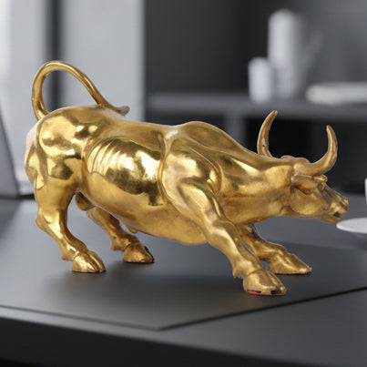 Gold bull statue on a desk