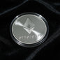 Silver Ethereum coin on a black background