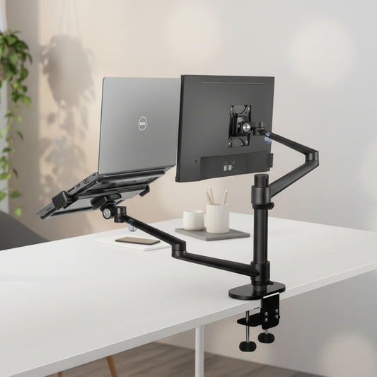 Black adjustable desk mount with laptop and monitor on a white background