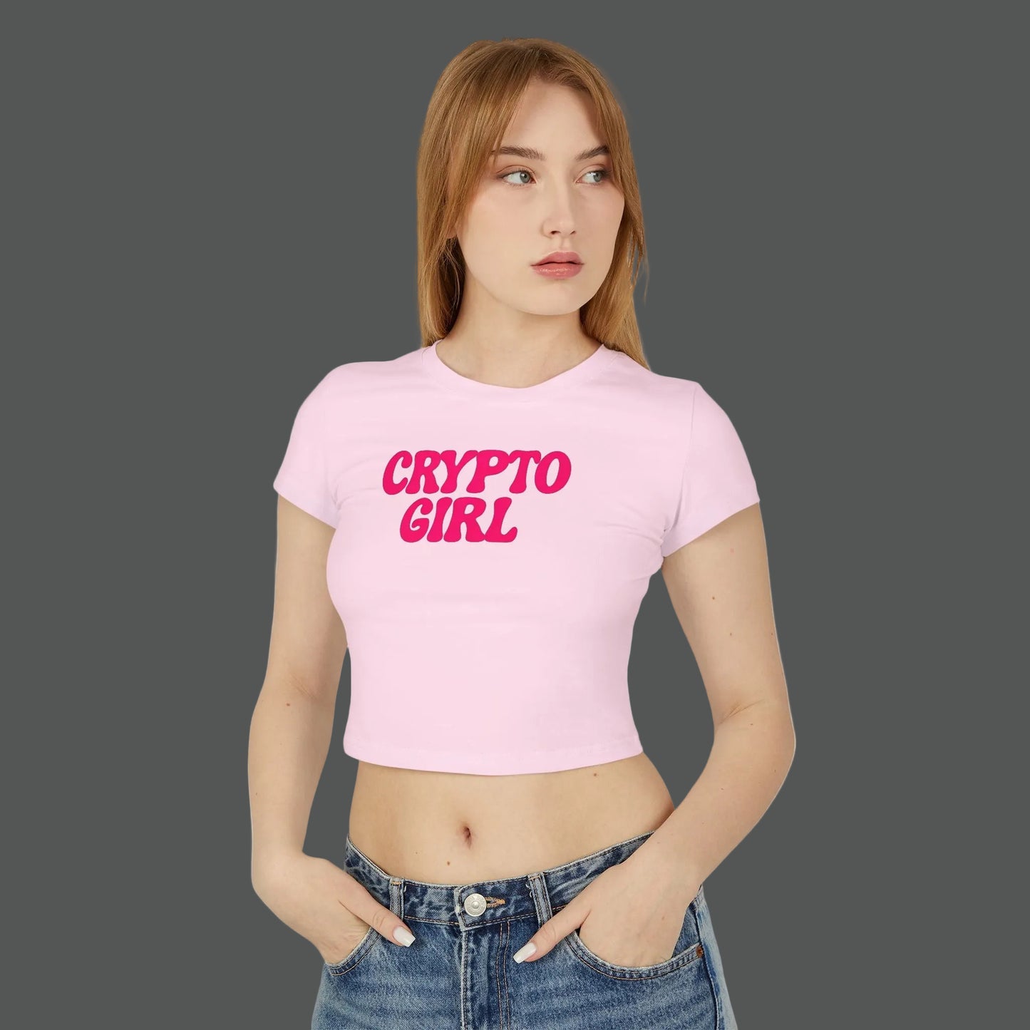 Woman wearing a pink 'CRYPTO GIRL' t-shirt on a white background
