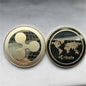 Two gold coins with Ripple logo and XRP symbol on a gray background