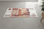 Large Russian 5000 ruble banknote rug on a plain floor.