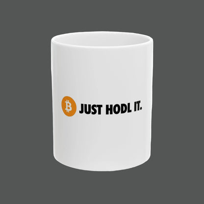 White mug with Bitcoin logo and 'JUST HODL IT.' text on a white background