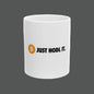 White mug with Bitcoin logo and 'JUST HODL IT.' text on a white background