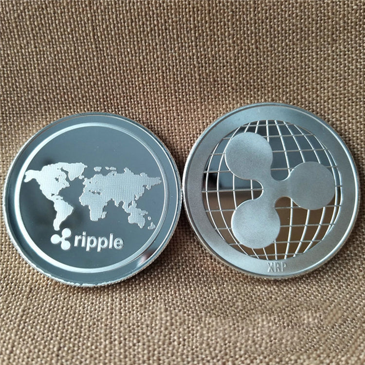 Two Ripple cryptocurrency coins on a textured brown background