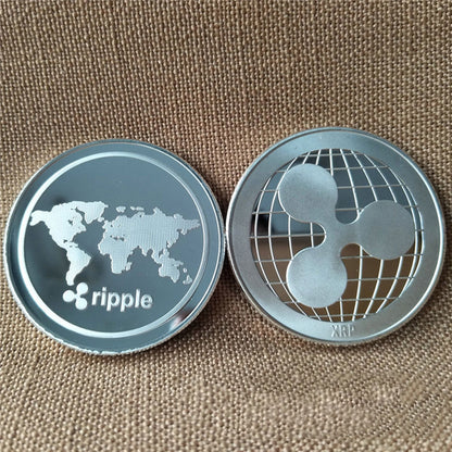 Two Ripple cryptocurrency coins on a textured brown background