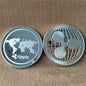 Two Ripple cryptocurrency coins on a textured brown background