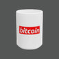 White mug with a red 'bitcoin' logo on a white background
