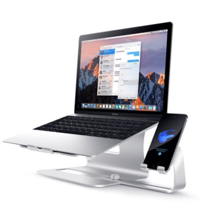 Laptop and smartphone on a stand with a white background