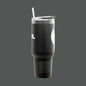 Black insulated tumbler with a straw on a white background