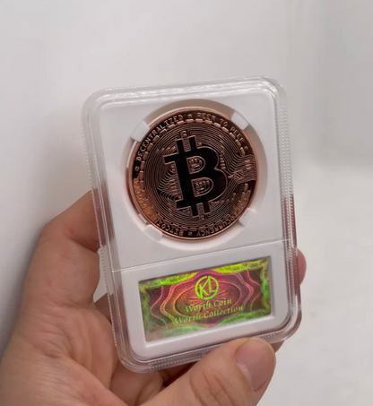 Copper Bitcoin coin in a protective case held by a hand against a white background
