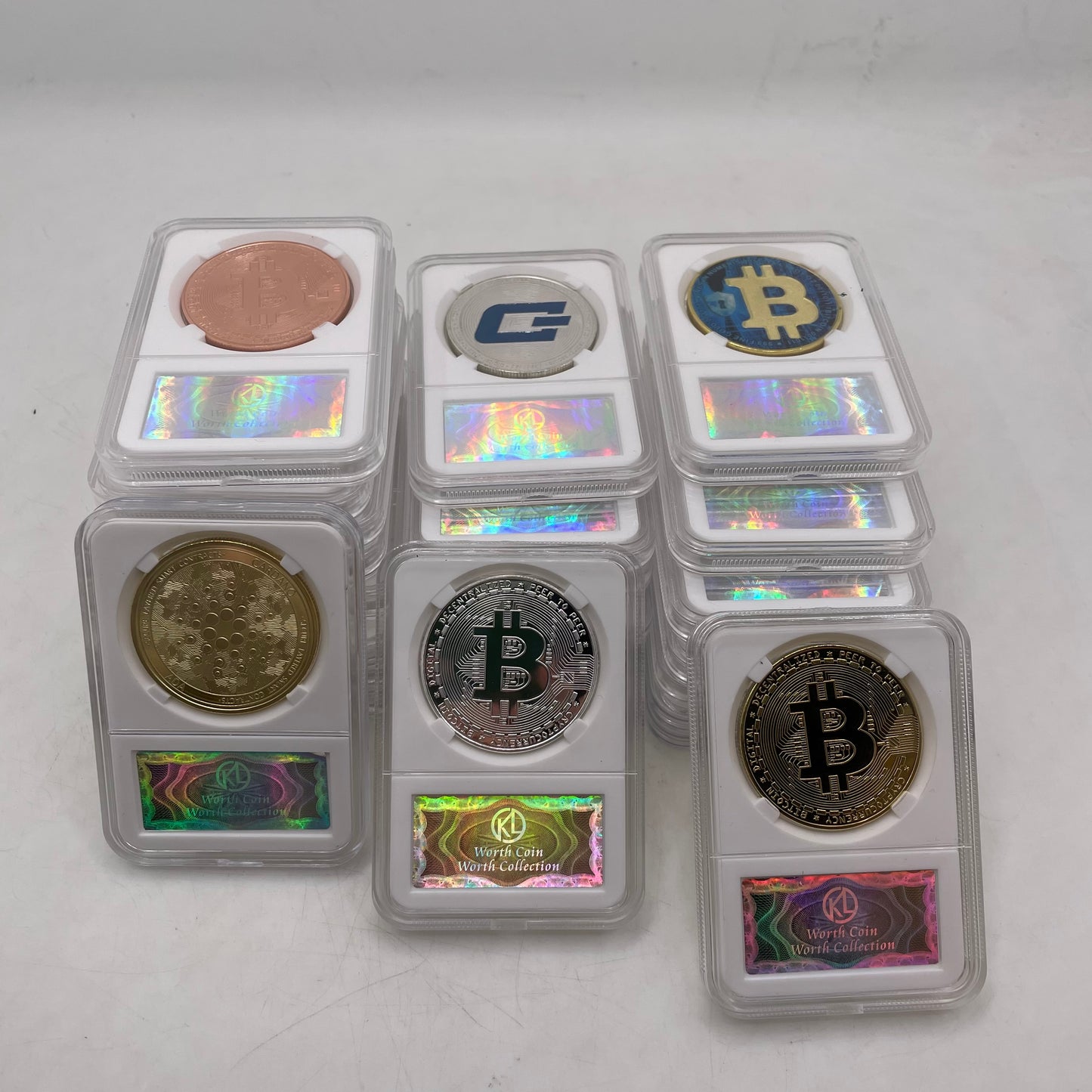 Collection of coins in protective cases on a white background